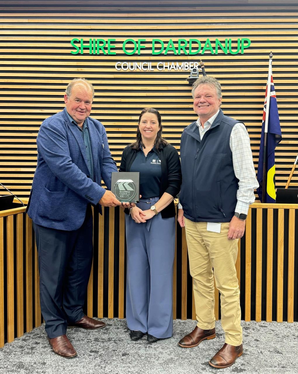 The Shire of Dardanup President Cr Tyrrell Gardiner and the Shire’s Director Infrastructure Theo Naude (right) receive a RoadWise Council honour from WALGA RoadWise Road Safety Advisor Katherine Celenza recently.